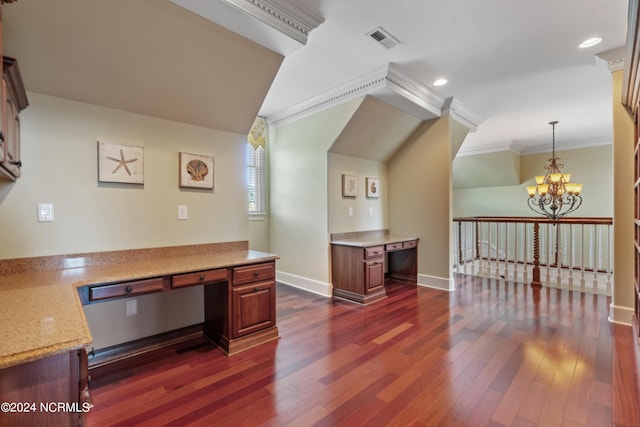 home office with visible vents, dark wood-type flooring, ornamental molding, built in study area, and baseboards