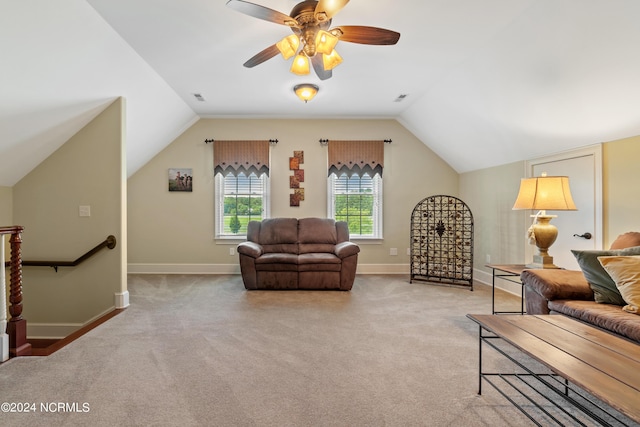 living room featuring ceiling fan, light colored carpet, and lofted ceiling