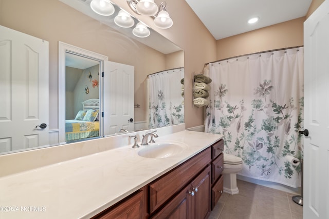 bathroom with tile patterned floors, vanity, and toilet