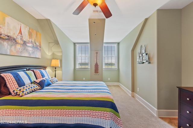 bedroom featuring light colored carpet and ceiling fan