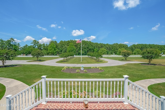 view of home's community featuring a lawn