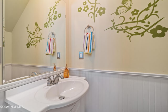 bathroom with wainscoting and vanity