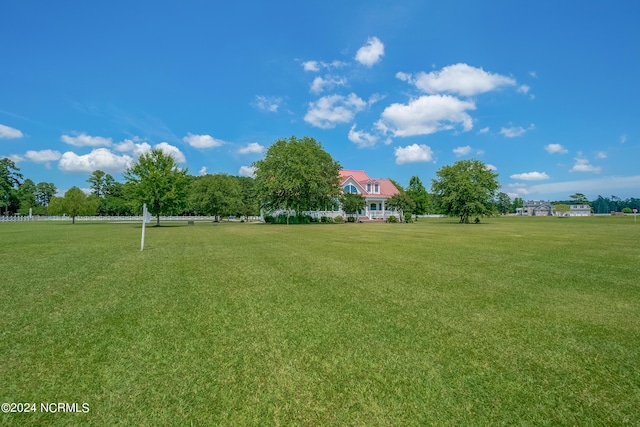 view of property's community with a lawn