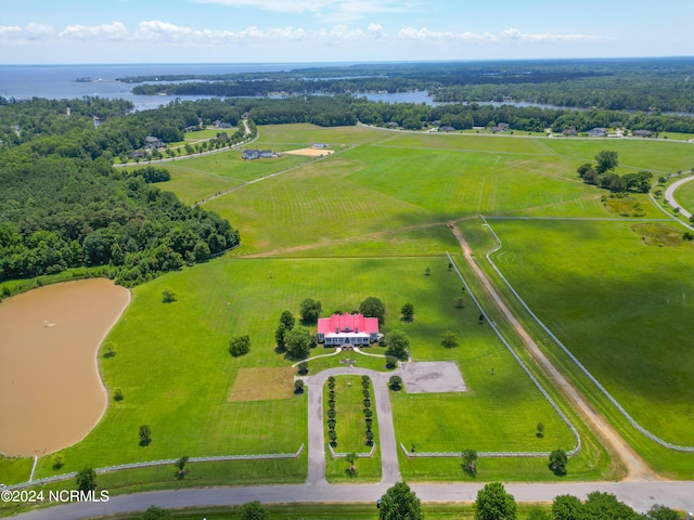 birds eye view of property with a rural view and a water view