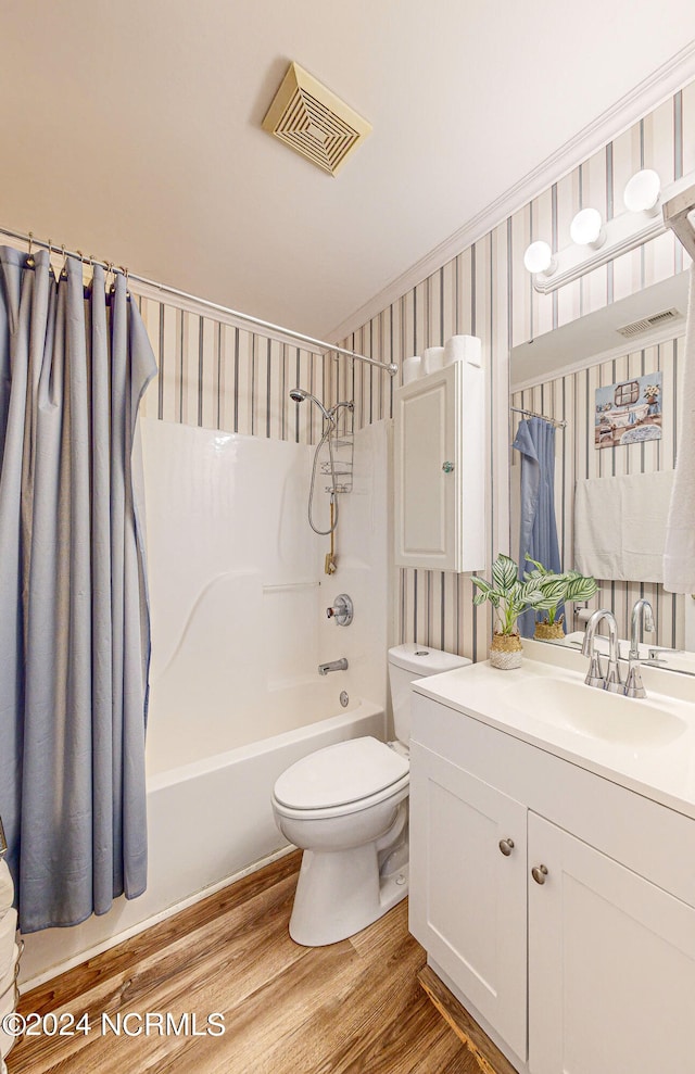 full bathroom featuring toilet, vanity, shower / bath combo, and hardwood / wood-style floors