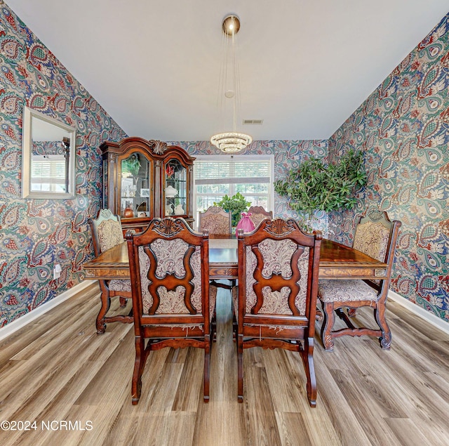 dining room with wood-type flooring