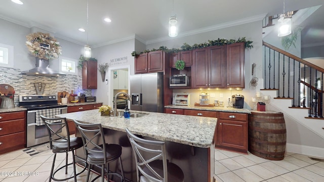 kitchen featuring pendant lighting, appliances with stainless steel finishes, and sink