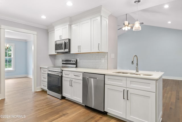 kitchen featuring stainless steel appliances, ceiling fan, sink, white cabinets, and hanging light fixtures