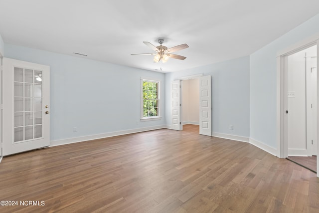 empty room featuring ceiling fan and wood-type flooring