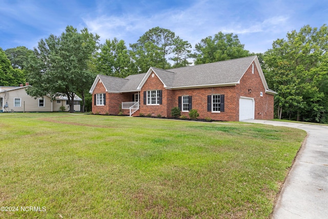 single story home with a garage and a front lawn