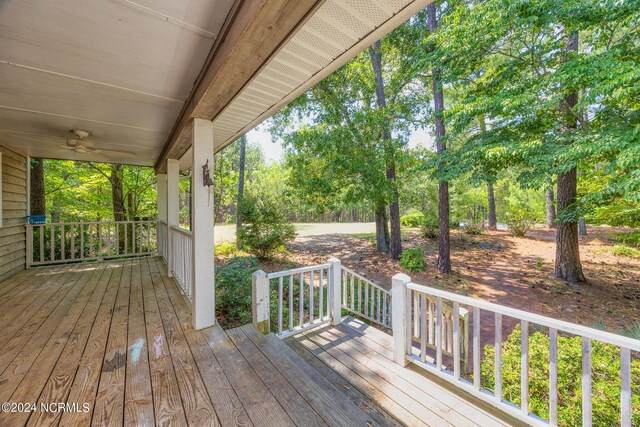 wooden deck featuring ceiling fan and covered porch