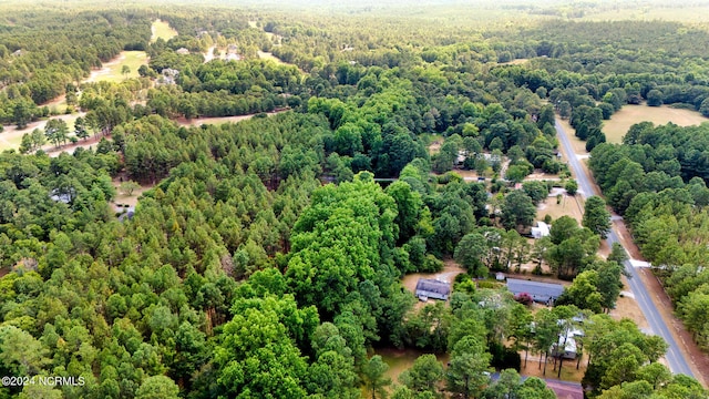 bird's eye view featuring a view of trees