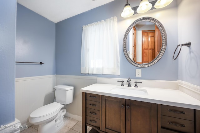 bathroom with vanity, tile patterned flooring, and toilet