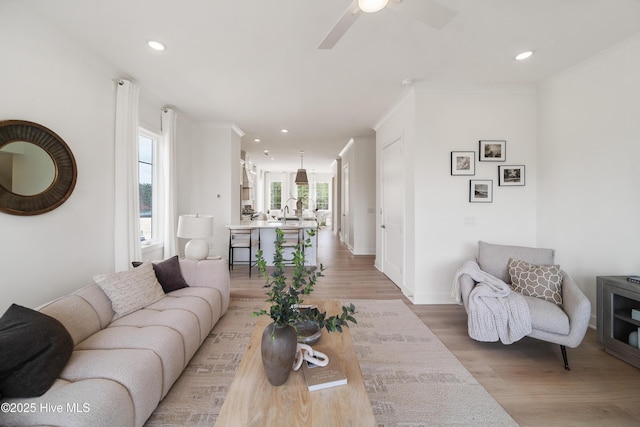 2601 Alvernia Dr, Castle Hayne, NC 28429 - living room featuring light wood finished floors, recessed lighting, ceiling fan, crown molding, and baseboards