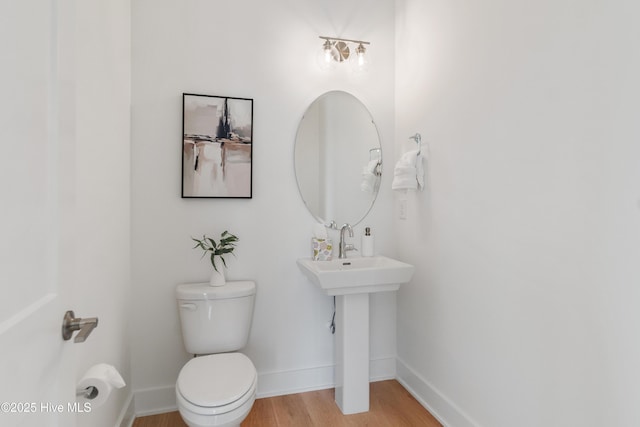 2601 Alvernia Dr, Castle Hayne, NC 28429 - bathroom featuring wood finished floors, toilet, and baseboards