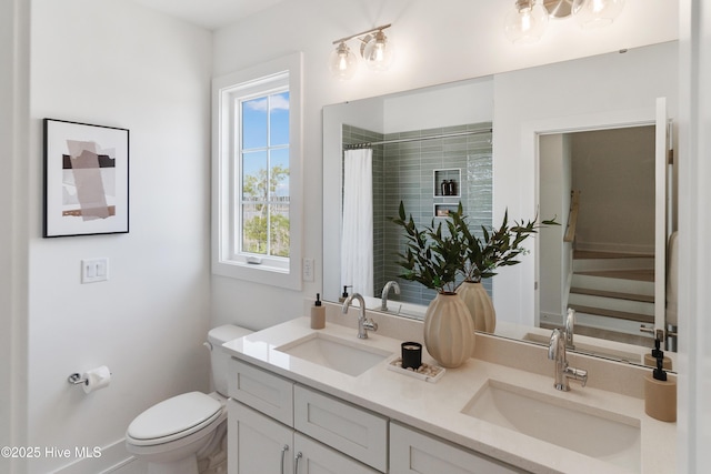2601 Alvernia Dr, Castle Hayne, NC 28429 - bathroom with double vanity, toilet, and curtained shower