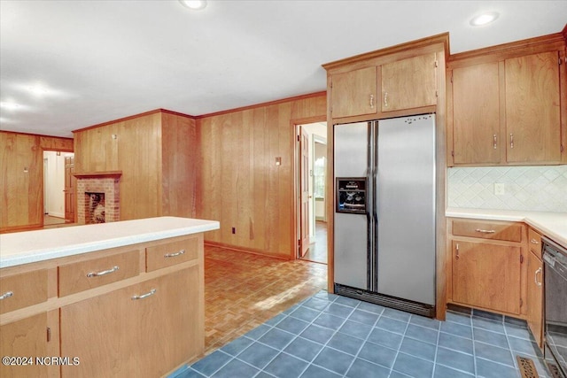 kitchen with wooden walls, black dishwasher, stainless steel fridge, decorative backsplash, and crown molding