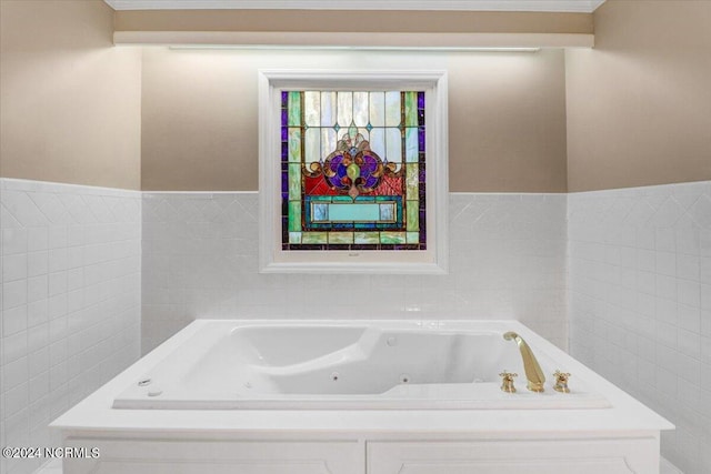 bathroom with tiled bath and tile walls