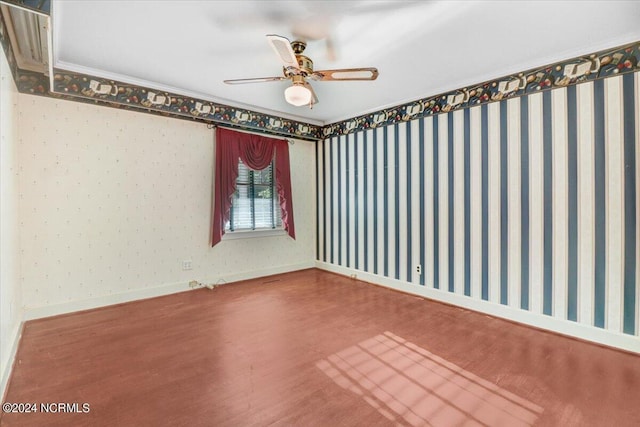 empty room with hardwood / wood-style flooring and ceiling fan