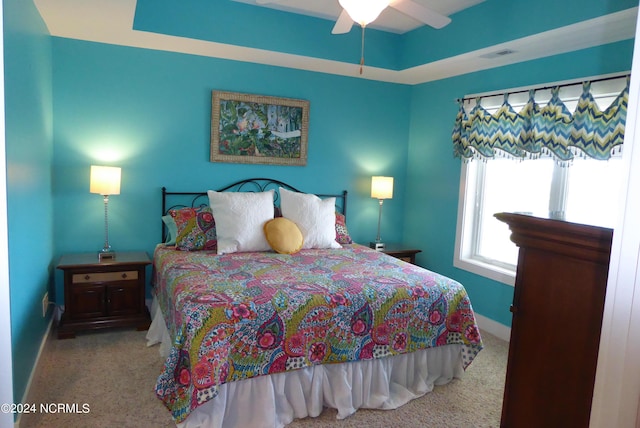 carpeted bedroom with ceiling fan