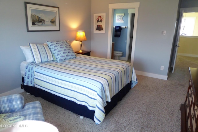 carpeted bedroom with connected bathroom