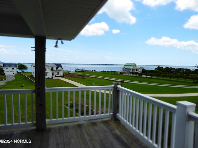 wooden deck featuring a water view