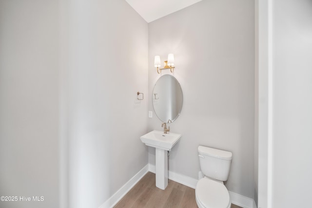 2597 Alvernia Dr, Castle Hayne, NC 28429 - bathroom with toilet and wood finished floors