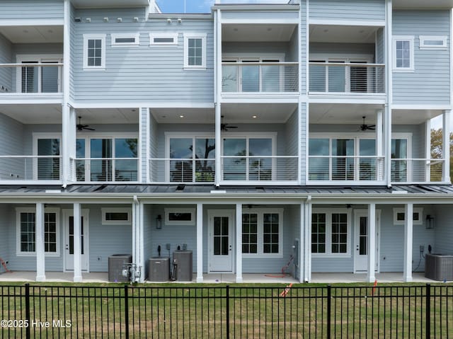 2597 Alvernia Dr, Castle Hayne, NC 28429 - back of property featuring ceiling fan, a standing seam roof, a balcony, and a patio