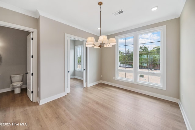 2597 Alvernia Dr, Castle Hayne, NC 28429 - unfurnished room with a chandelier, ornamental molding, light wood-type flooring, and recessed lighting