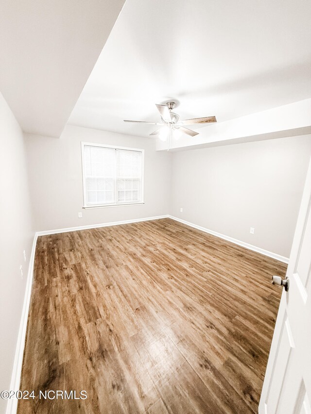 unfurnished room featuring hardwood / wood-style flooring and ceiling fan