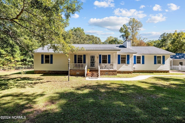 view of front facade with a porch, crawl space, roof with shingles, and a front yard