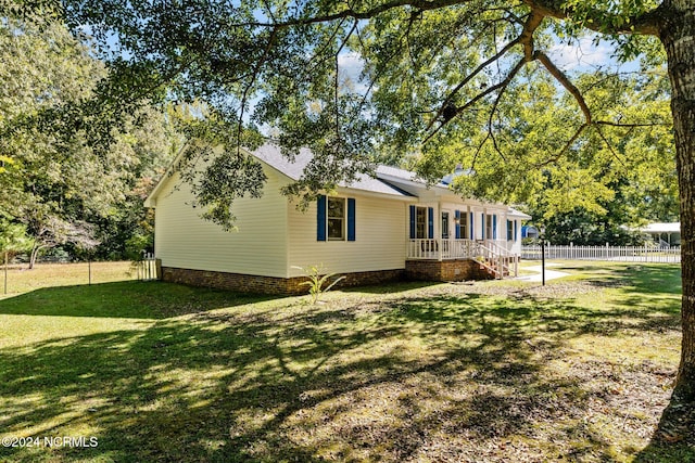 view of property exterior featuring a yard