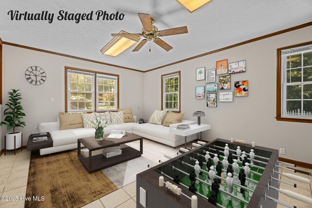 tiled living room featuring crown molding and ceiling fan