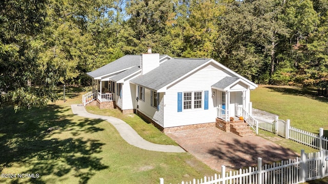 bungalow-style house with a front lawn