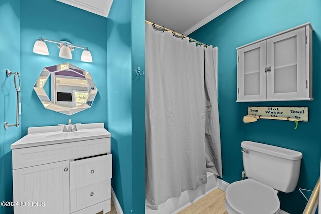 full bathroom with ornamental molding, vanity, shower / tub combo with curtain, and toilet