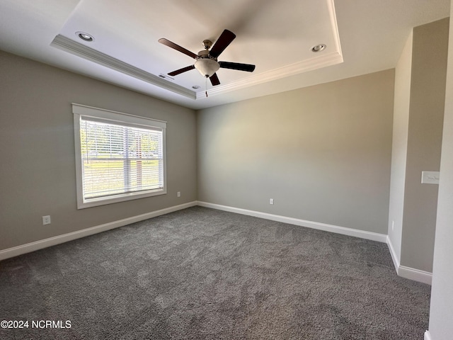 207 Eaton St, Carthage, NC 28327 - empty room with a raised ceiling, a ceiling fan, baseboards, dark colored carpet, and recessed lighting