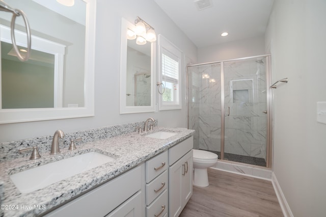 207 Eaton St, Carthage, NC 28327 - bathroom featuring a marble finish shower, toilet, double vanity, wood finished floors, and recessed lighting
