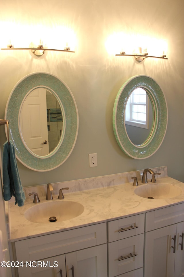 bathroom with dual bowl vanity