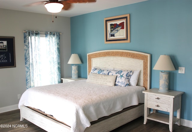 bedroom featuring multiple windows, ceiling fan, and dark hardwood / wood-style floors