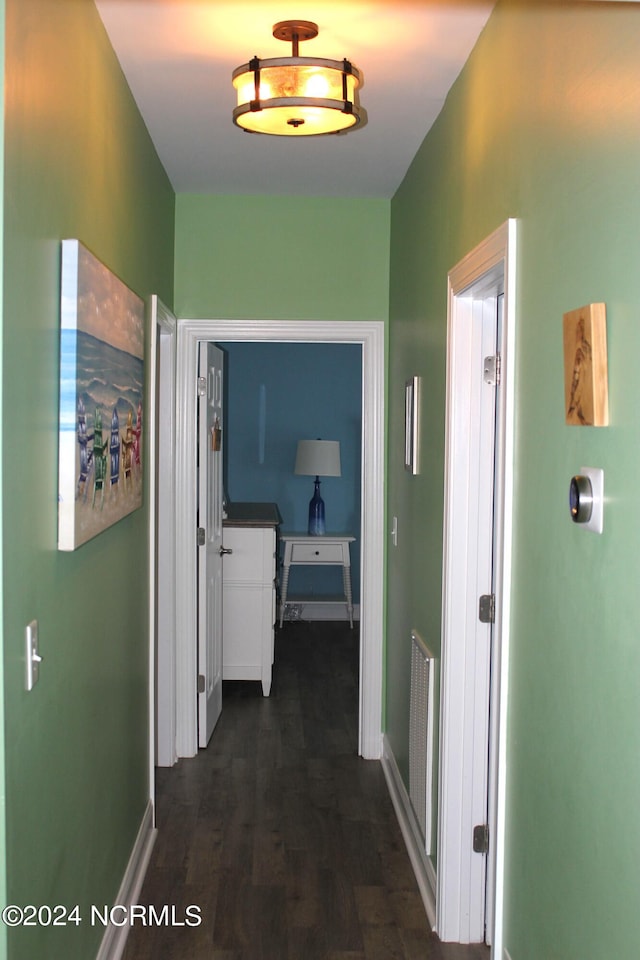 corridor featuring dark hardwood / wood-style floors