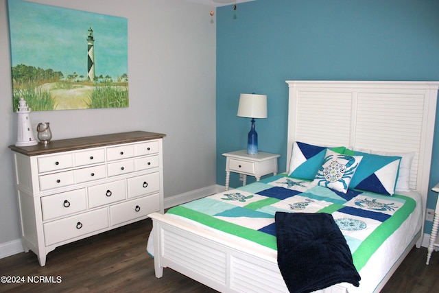 bedroom featuring dark hardwood / wood-style flooring