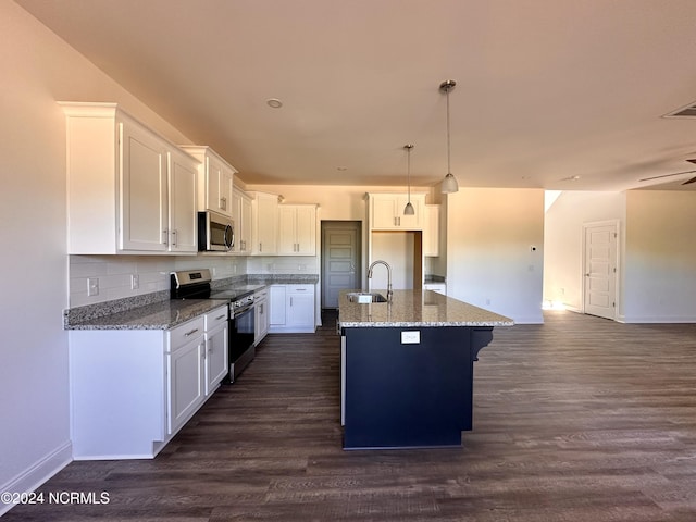 kitchen with stainless steel appliances, dark wood-type flooring, stone countertops, and a sink