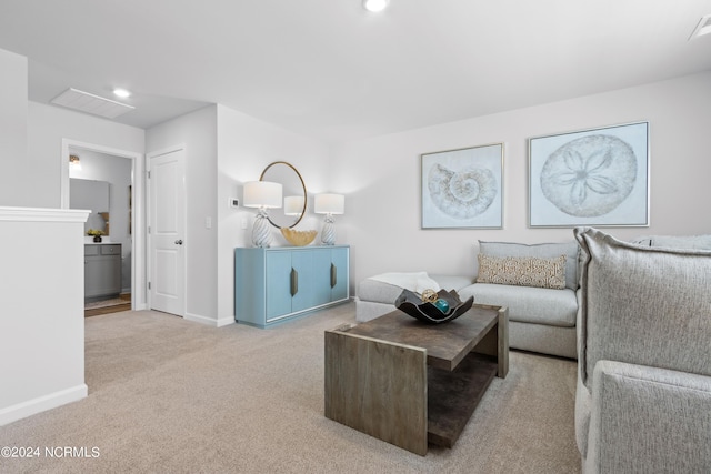 living area featuring carpet floors, baseboards, visible vents, and recessed lighting