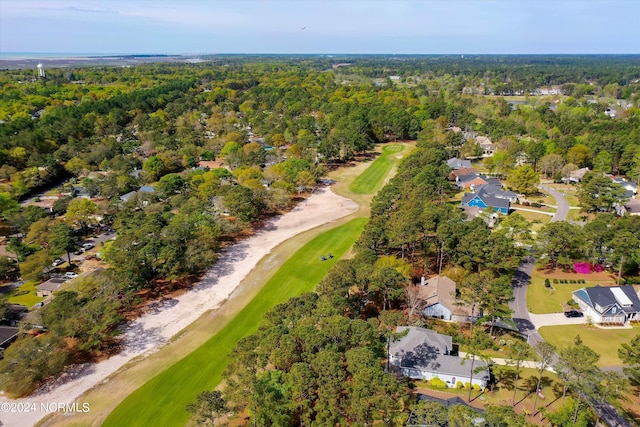 birds eye view of property featuring a wooded view