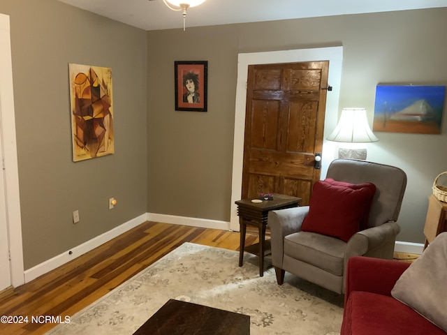 living area with hardwood / wood-style floors