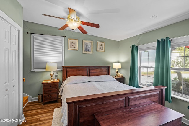 bedroom featuring a closet, hardwood / wood-style flooring, and ceiling fan