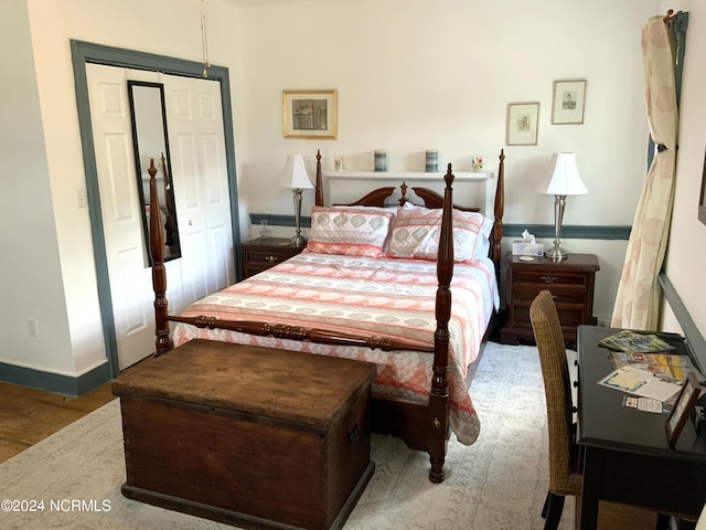 bedroom with a closet and light hardwood / wood-style floors