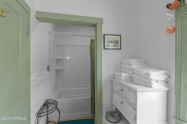 bathroom featuring vanity and shower / tub combo with curtain