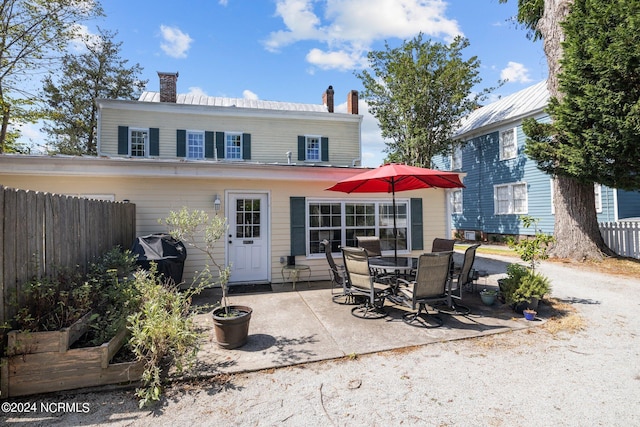 rear view of house featuring a patio area