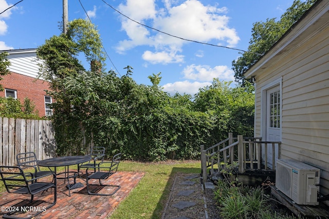 view of yard featuring a patio area and ac unit